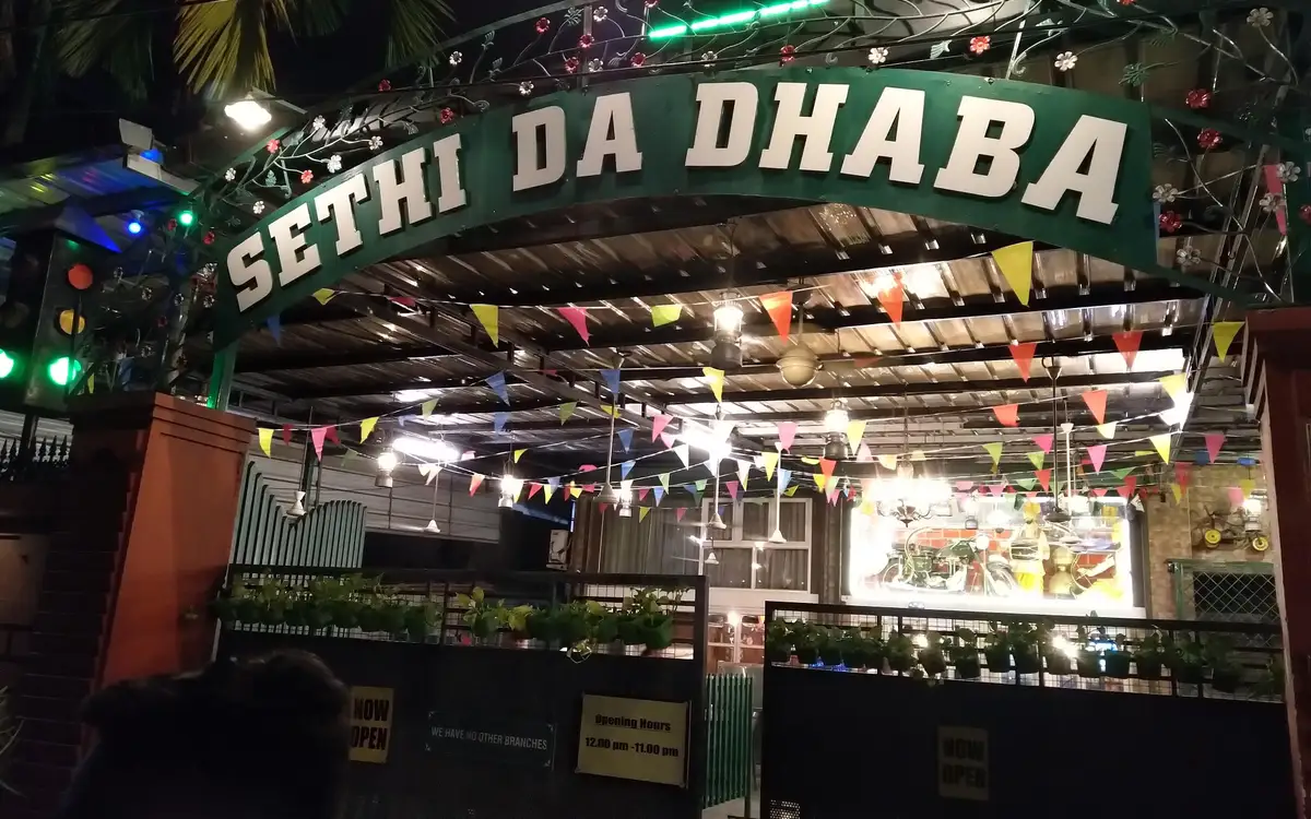 Sethi Da Dhaba entrance at Kadavanthra, photographed at night.