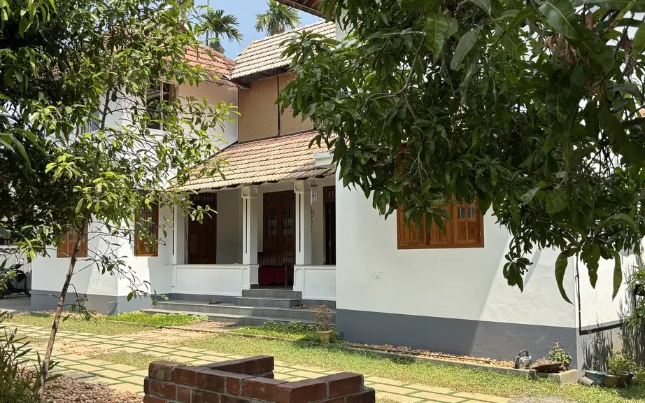 The Nedumudy homestay building shown on Good Friends Inn's Kerala Tourism listing.