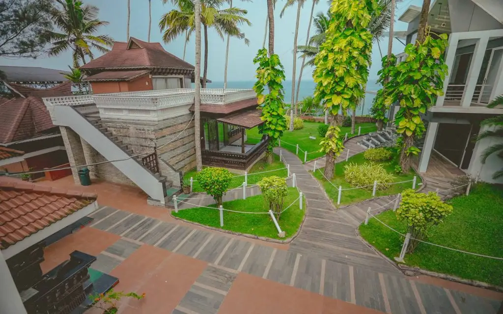 Akhil Beach Resort's coastal garden and accommodation buildings on its current website; confirm the specific room or unit.
