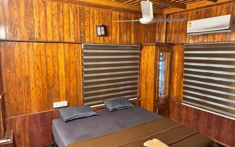 A wood-lined Moonwaves Beach Resort room shown on the operator website; confirm the room category before booking.