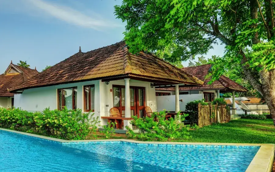 swimming pool in front of a room at Rhythm Kumarakom