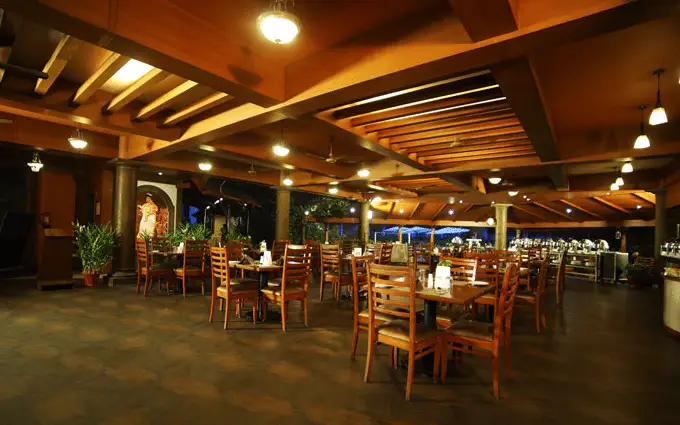 Tables, wooden ceiling and buffet counters at Southern Express, Uday Suites.