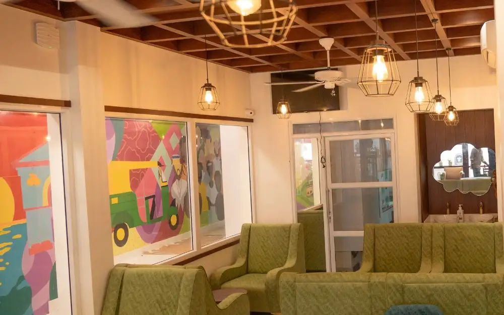 Interior seating published in The Lilly’s Stories operator gallery; confirm current dining tables and access directly. Photograph date not established.