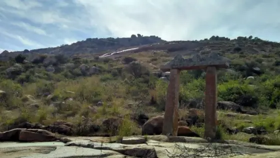 A stone gateway surviving on the Hullukudi hill route.