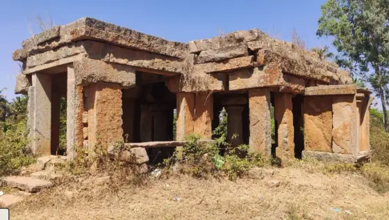 A pillared stone structure within Manne’s dispersed heritage landscape.