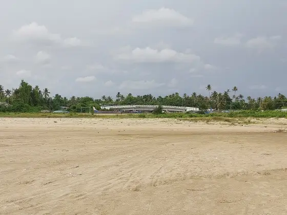 The north bridge at Andhakaranazhi beyond the broad exposed sand, photographed in May 2023.