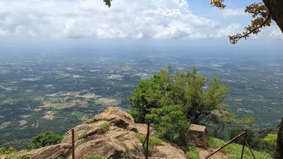 Bare rock and grass on the tops above the road, the same ground the Karadipara shoulder is part of.