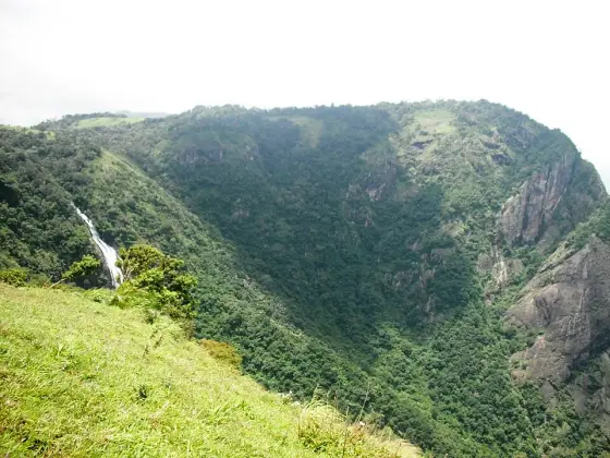 The seasonal waterfall below the lip of the escarpment, which runs hard during and after the rains and thins to a stain on the rock by February.