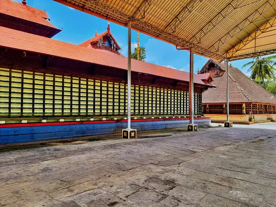 The paved passage beside the temple wall.