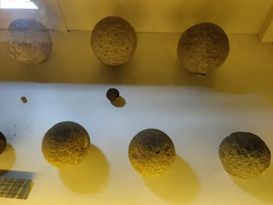 Circular metal objects displayed in the museum.