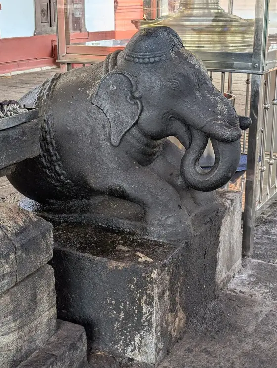A carved animal figure at Lokanarkavu.