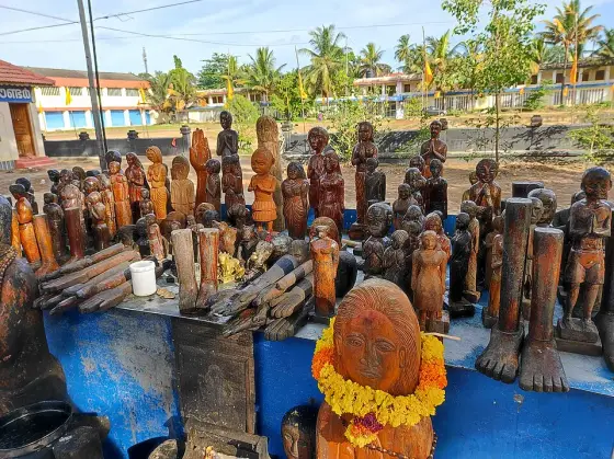 Wooden figures displayed at Oachira.