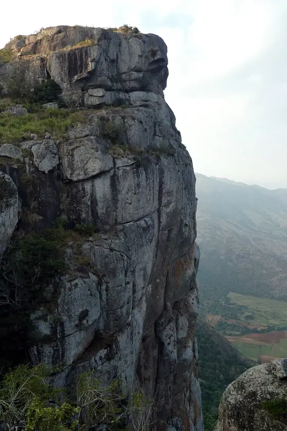 Ramakkal from below: stacked granite with a sheer face on the valley side, 1,063 m at the crest.