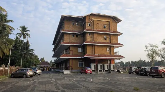 The multi-storey building beside the Sargaalaya pond.