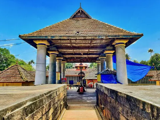 The approach through a tiled porch at Thiruvanchikulam.