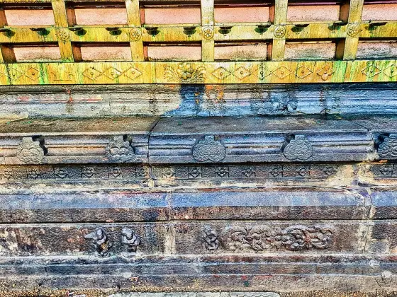 Carved stone courses along the temple wall.