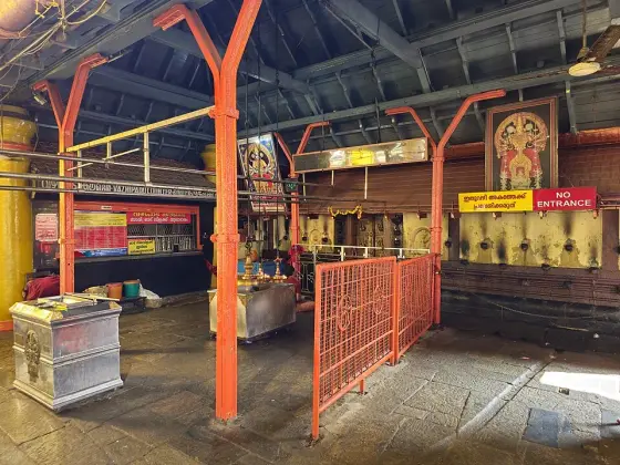 The covered passage and railings inside the temple complex.