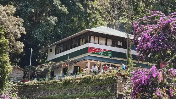 A building above the stream at Lakkam Waterfalls.