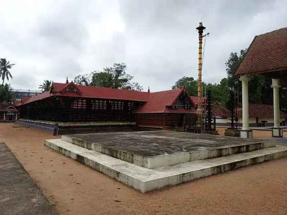 A side view of the timber shrine and its tiled roof.
