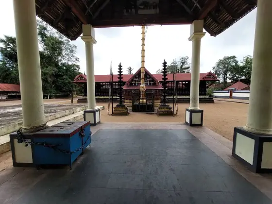 The covered approach opens towards Cherthala temple courtyard.