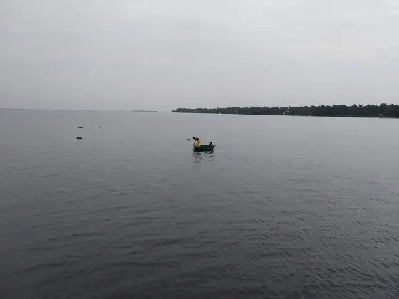 A small fishing craft on the open lake.