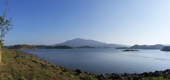 Open reservoir water beneath the Wayanad hills.