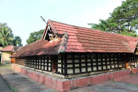 Lamp-lined walls beneath a low tiled roof.