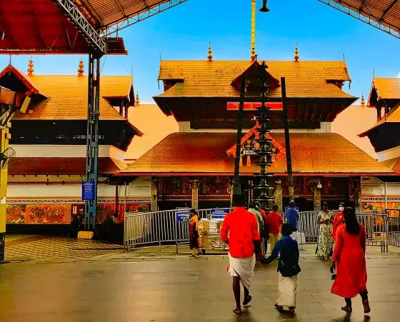 The temple entrance and tall lamp pillar.