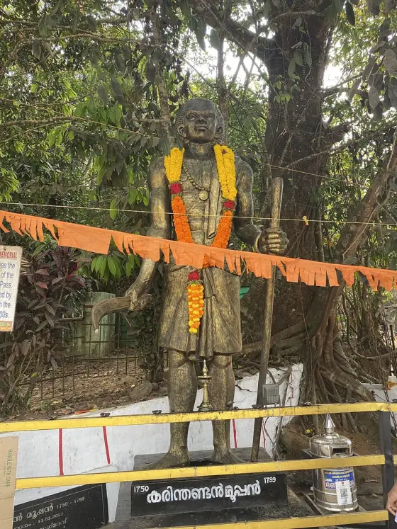 Karinthandan memorial beside the Chain Tree.