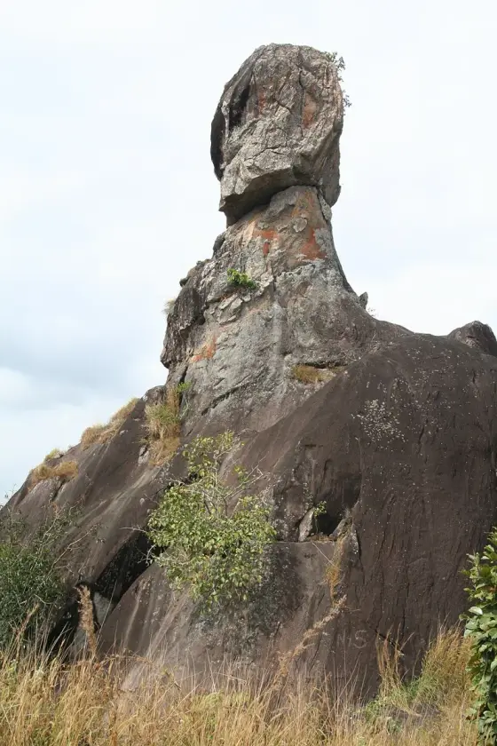 The head-shaped upper rock above its narrower base.