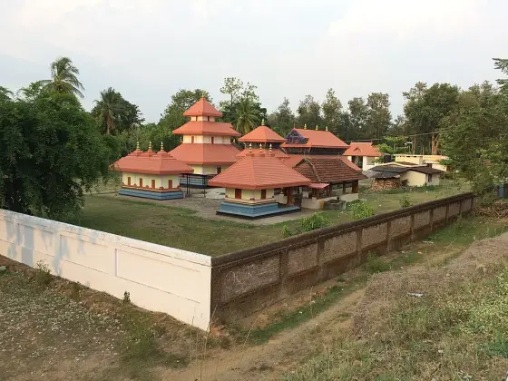 Pulpally temple buildings beside the large pond.