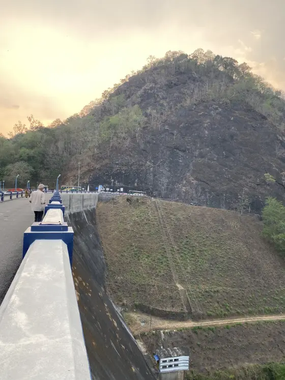 Ponmudi’s steep downstream face and service stair below the crest.