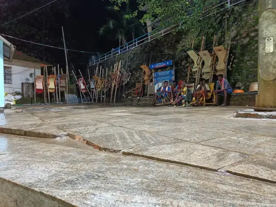 An archival view records bearers carrying a pilgrim in a dolly on the Sabarimala route.