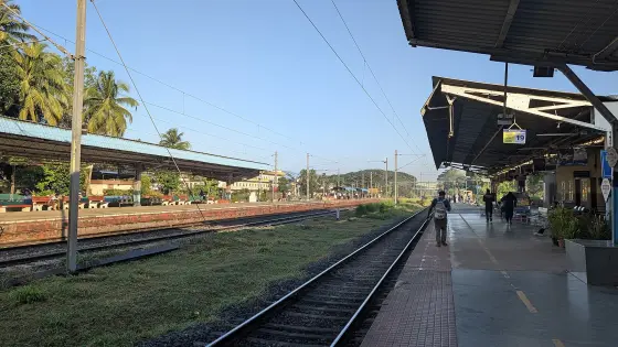 Kanhangad railway station’s covered platforms and tracks provide the rail-arrival context for the beach visit.