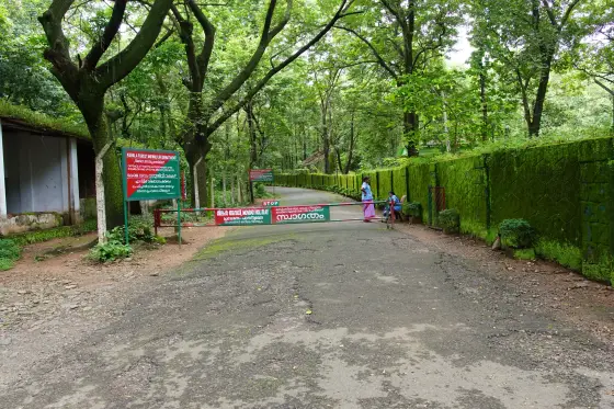 A red-and-green barrier marks the entrance approach.