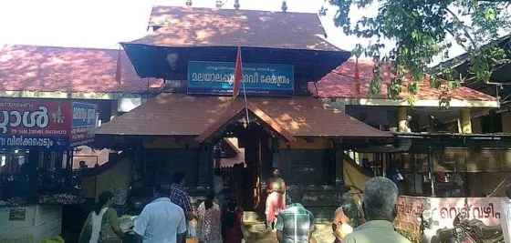 A daytime view shows the temple entrance and its surrounding enclosure.