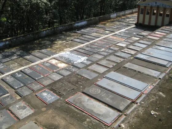 Rows of grave slabs in Bharananganam’s cemetery precinct, separate from the parish nave.