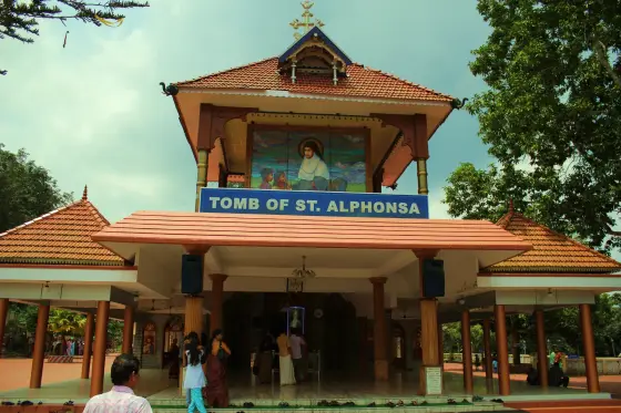 The separate shrine entrance bears the sign “Tomb of St. Alphonsa”.
