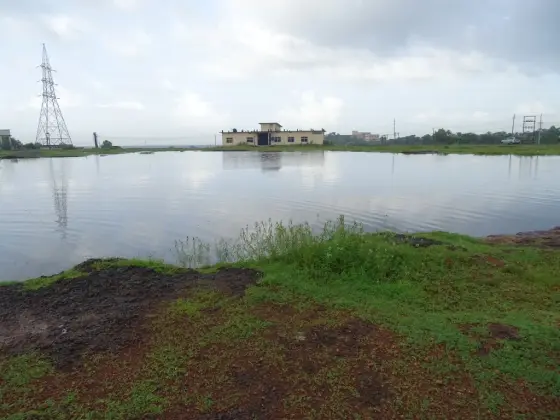 A separate rock pond on Madayipara beside utility buildings; this is not Vadukunda temple pond.