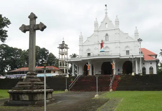 The stone courtyard cross in front of St Mary’s, with the separate bell tower on the left.