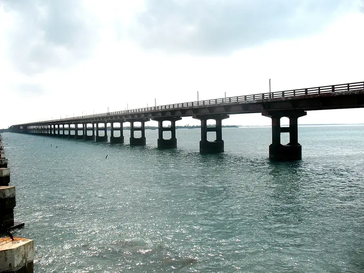 The Pamban rail bridge curving across the sea between the mainland and Pamban Island