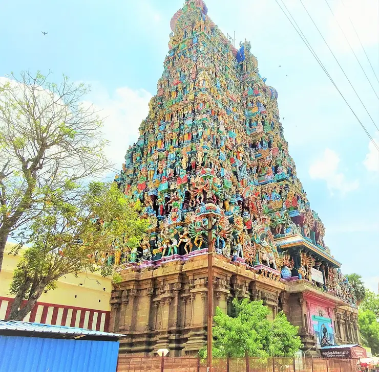 The towering, sculpture-covered gopurams of the Meenakshi Amman Temple in Madurai