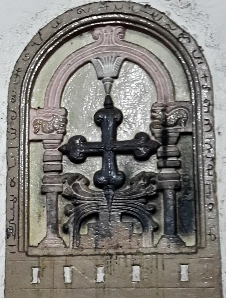 The Pahlavi-inscribed Persian cross set into the altar wall of Kadamattom Church, Ernakulam