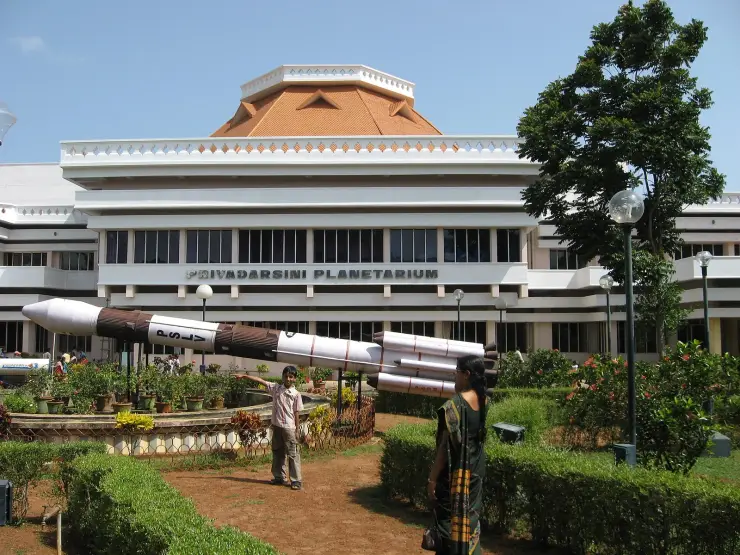 The Kerala Science and Technology Museum complex in Thiruvananthapuram with the planetarium dome behind the trees