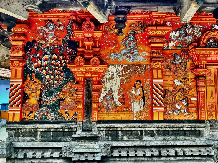 Puranic mural panels at Thali Temple, Kozhikode, painted in the restricted red and ochre palette of Kerala mural tradition