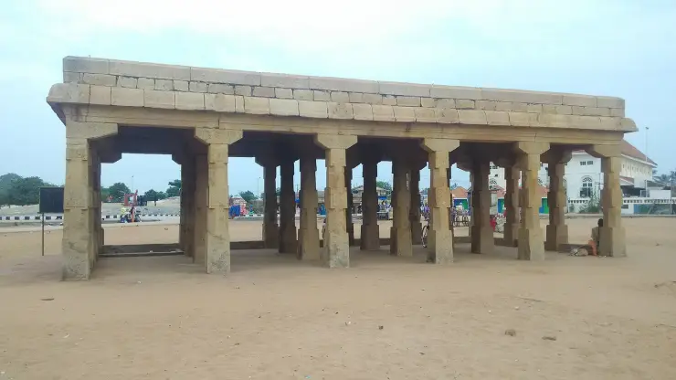 The Arattu Mandapam, a plain granite colonnade standing open on the sand at Shanghumukham beach
