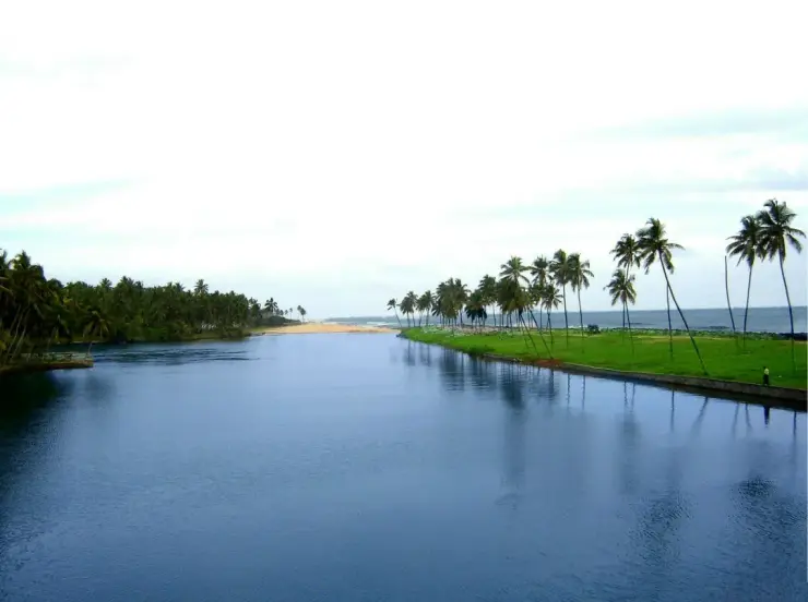 The Edava–Nadayara backwater running towards the sea, with the sand spit closing the far end