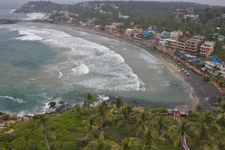 Lighthouse Beach at Kovalam seen from the lighthouse, the full crescent of sand backed by a continuous line of cafés and guesthouses