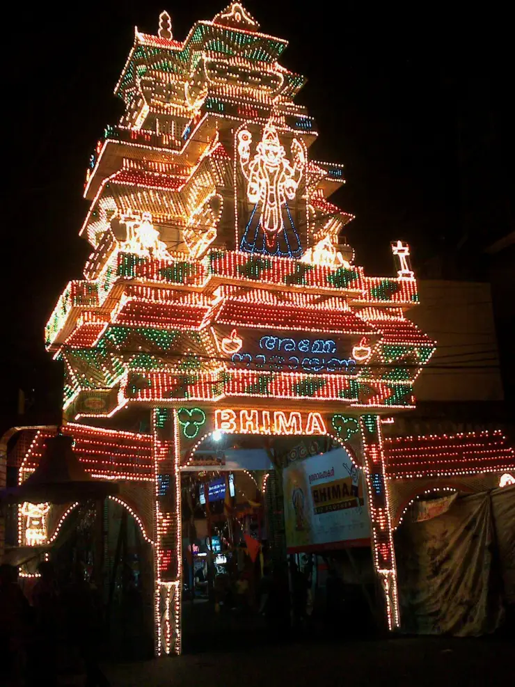 An illuminated arch over Mullakkal road, Alappuzha, built from individual filament bulbs