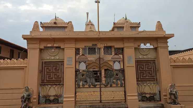 The gateway of the Dharmanath Jain Temple, Mattancherry, with swastika panels, lotuses, elephants and guardian figures